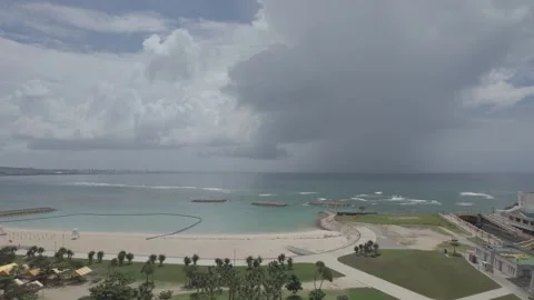 Resort hotel and empty beach in Chatan, Okinawa during tsunami warning Stock Footage 325681185