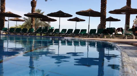 Resort hotel pool with palms Stock Footage 35155394