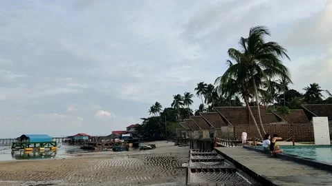 Resort on a low tide beach with a comfortable afternoon atmosphere Stockbeeldmateriaal 232321851