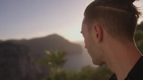 Resort Package 147 | closeup vlog handheld shot man walking out resort balcony Stock Footage 118526112