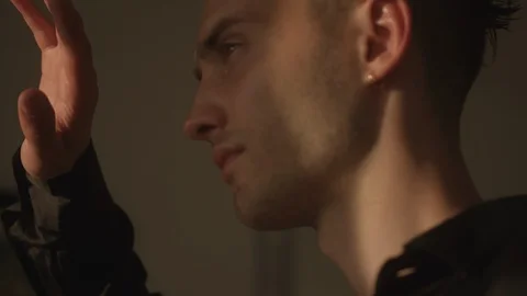 Resort Package 149 | man looking out walking out balcony covering face in sun Stock Footage 118527895