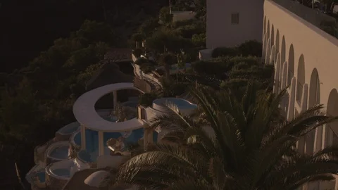 Resort Package 151 | zoom in dynamic evening shot of pool resort spa Stock Footage 118528252