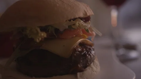 Resort Package 164 |close up of delicious hamburger dinner table at resort Stock Footage 118653702