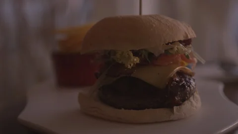 Resort Package 166 |hamburger dinner table woman dipping fries in mayonnaise Stock Footage 118653719