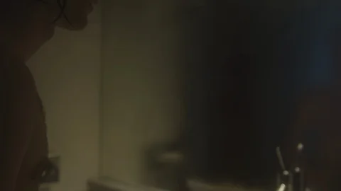 Resort Package 63 |man after shower cleaning wiping bathroom mirror with hand Stock Footage 118452301