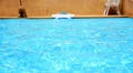 Resort Pool Water Ripples in the Sunlight. Chilling out in Thailand. HD Footage