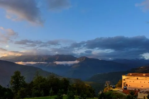 Resort in the rays of the setting sun in the mountains. Stock Photos