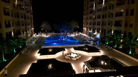 Resort swimming pool at night Stock Footage 193993989