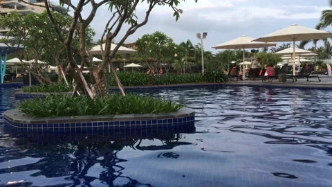 A resort swimming pool at twilight Video stock 146936213
