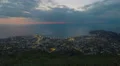 Resort town near sea, night city lights timelapse, view from mountain peak 4k or 4k+ Resolution