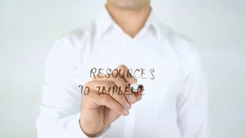 Resources To Implement, Man Writing on Glass Stock Footage