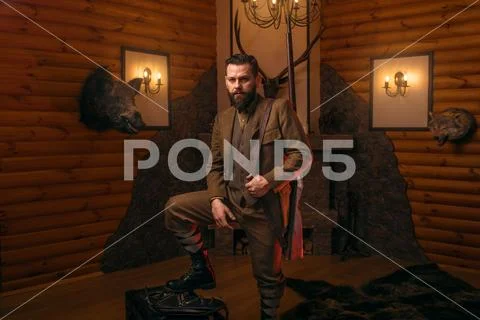 Respectable hunter man with old gun Stock Photos