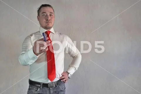 A respectable man in a business style in a white shirt with a red tie and large Stock Photos