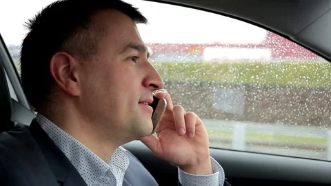 Respectable, responsible man driving car and speaking on mobile phone Stock Footage 81305154
