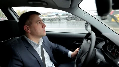 Respectable, responsible man driving car. The man in a suit.  Stock-Footage 81305764