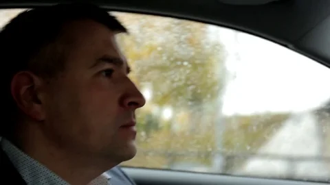 Respectable, responsible man driving car. The man in a suit.  Stock Footage 81305787
