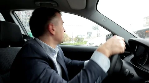 Respectable, responsible man driving car. The man in a suit.  Stock Footage 81305805