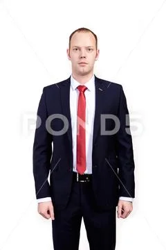 Respectable senior businessman, wearing black suit, white shirt and red tie Stock Photos