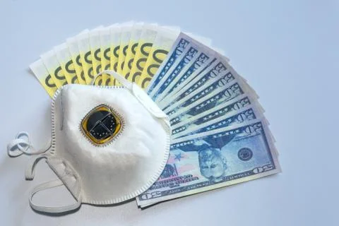 Respirator on the background of paper money Stock Photos