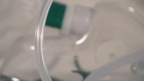 Respirator oxygen mask alone on an empty hospital bed as the patient past away Stock Footage 127264014