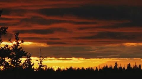 Resplendent Cloudy Mountain Sunset with Trees Stock Footage 11136811