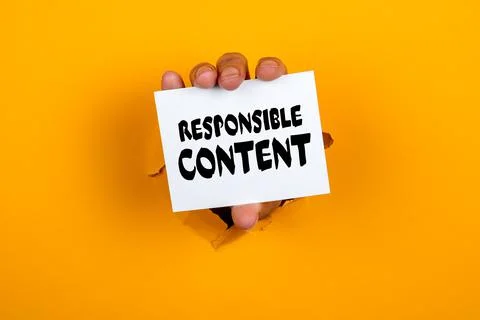Responsible Content. Note paper in a woman's hand. Yellow background Stock Photos