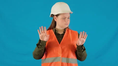 Responsible female engineer shows hands raising index finger Stock Footage 316111859