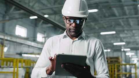 Responsible knowledgeable good-looking middle-aged African-American male Stock Photos