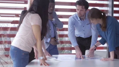 Responsible young adults analyzing the world map Stock Footage 73865666