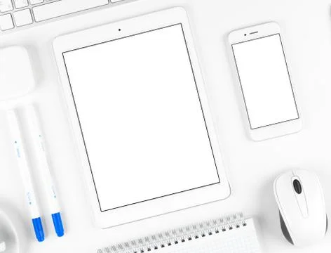 Responsive design: Keyboard, tablet and smartphone on white table Stock Photos
