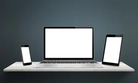 Responsive devices on desk with isolated screen for mockup. Laptop, tablet an Stock Photos