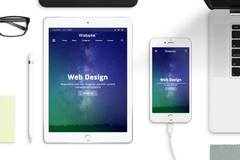 Responsive web site desing on tablet and smart phone screen Stock Photos