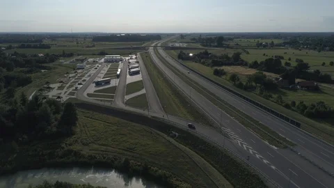Rest area for drivers. Fly above lorry trucks parking place spot near highway. Stock Footage 114356839
