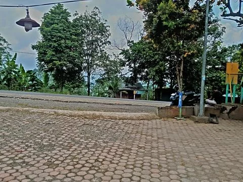 A rest area featuring a large paving block, an asphalt road Stock Photos