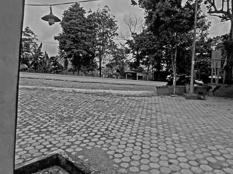 A rest area featuring a large paving block, an asphalt road Stock Photos
