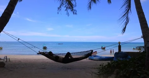 Rest in hammock on a sand beach Stock Footage 89518263