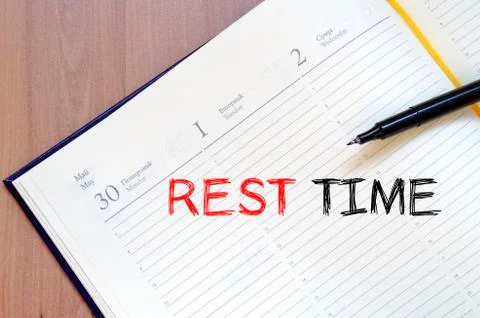 Rest time write on notebook Stock Photos