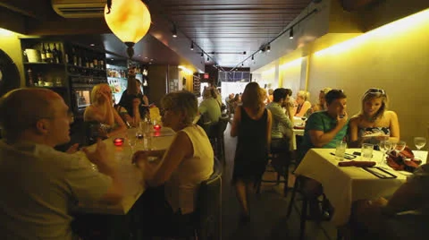 RESTAURANT, BUSY,  SERVERS WALKING BY Stock Footage 23727162