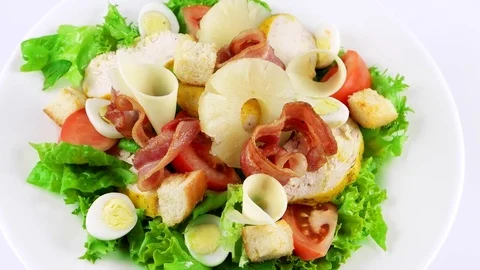 Restaurant Caesar salad with chicken breast, pineapple, quail eggs, beacon Stock Footage 73507945