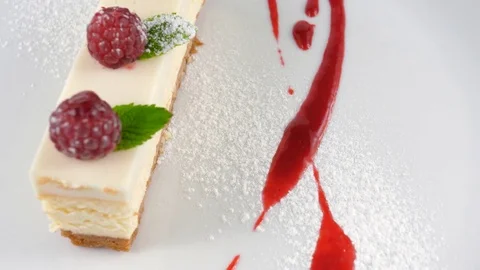Restaurant Cheesecake with raspberry Stock Footage 79984381