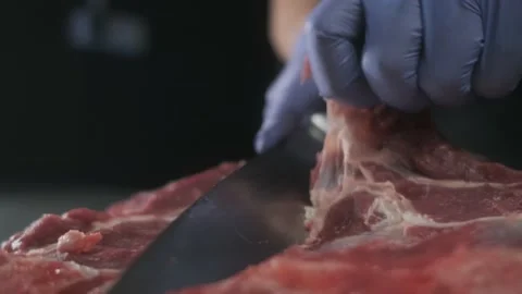 Restaurant chef cut raw meat; hands cutting, slicing delicate beef 4K Stock Footage 170832518