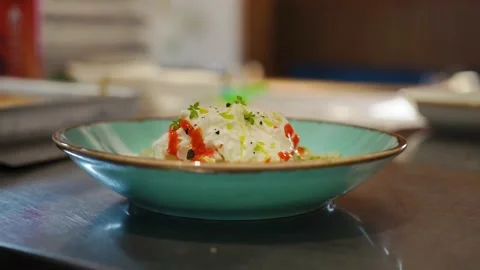 Restaurant chef decorates the dish before serving with tweezers Video stock 140963310