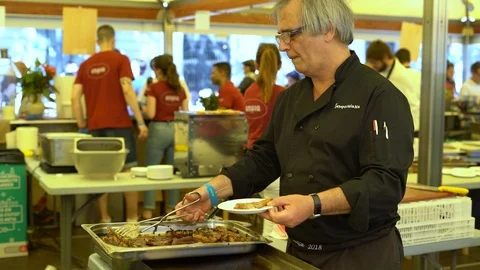 Restaurant chef prepares lamb ribs in the outdoor kitchen Stock Footage 111592434