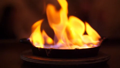Restaurant chef preparing food dish fire Flames flaming hotel restaurant kitchen Stock Footage 85488729