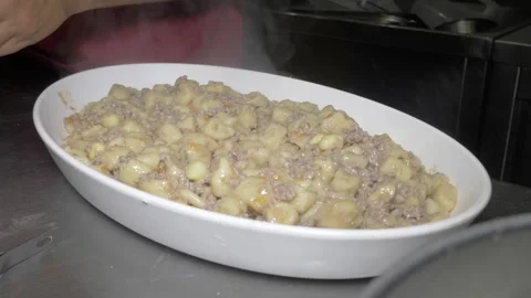 Restaurant Chef Quickly Plating Gnocchi and Ragu for Large Party Service Video stock 336793606