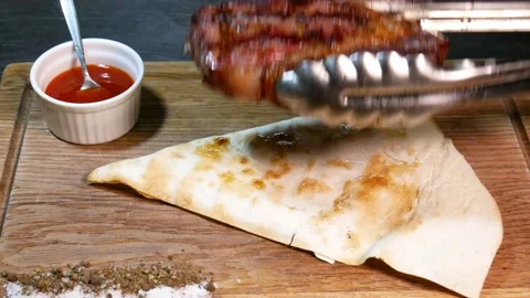 Restaurant chef slicing medium rare beef steak. Stock Footage 131718516