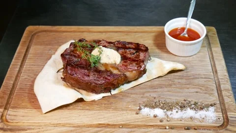 Restaurant chef slicing medium rare beef steak. Stock Footage 131718727