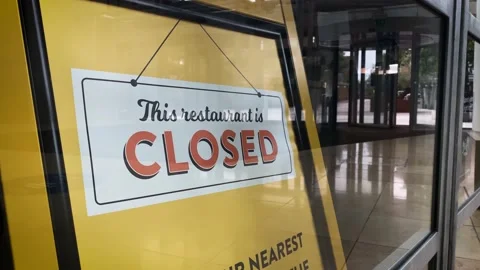 This restaurant is closed, sign in shop window in empty shopping centre Stock Footage