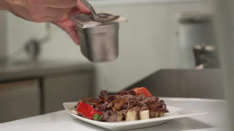 Restaurant cook prepares a delicious Iskender Kebab dish 스톡 동영상 335384673
