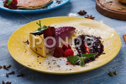 Restaurant dessert. Berry tart on blue wood Stock Photos